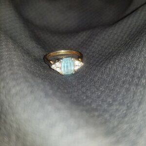Ladies ring light blue stone and diamond golden ring